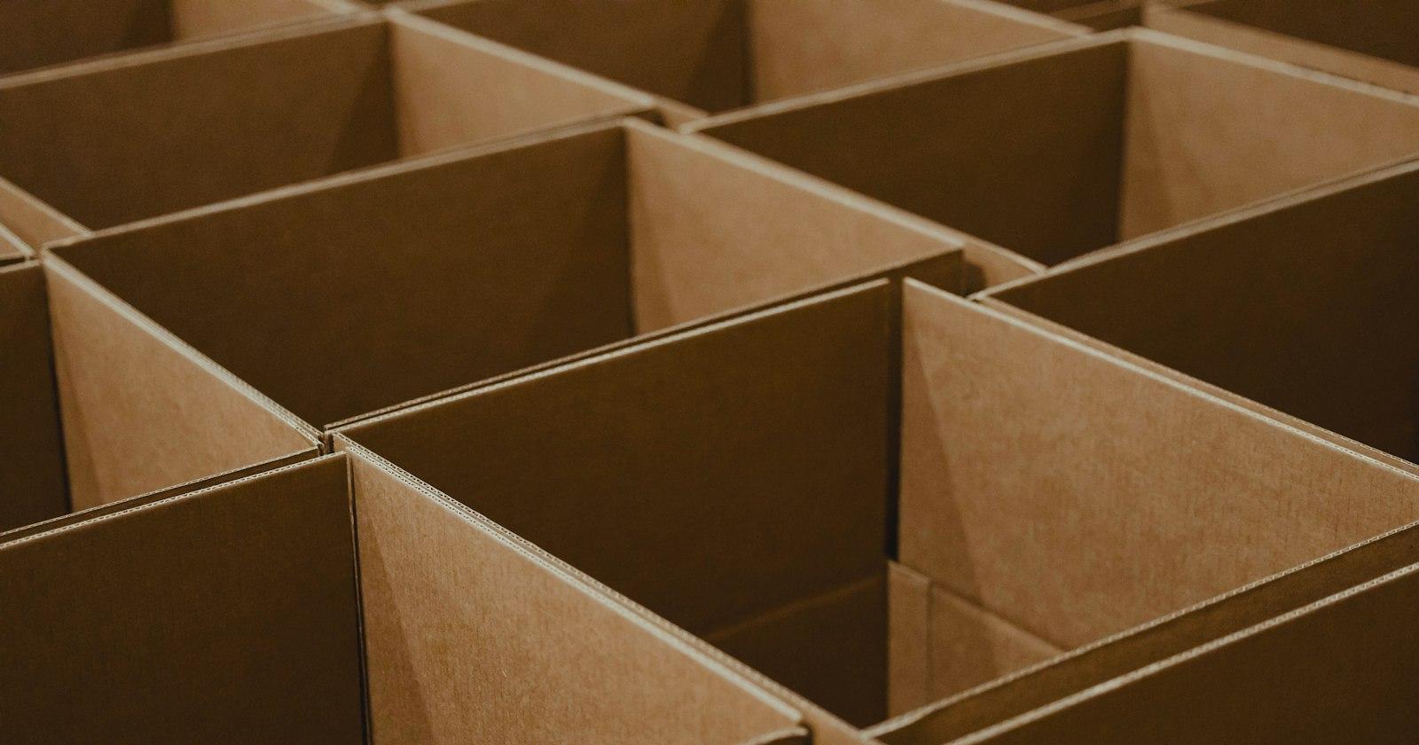 Rows of open cardboard boxes